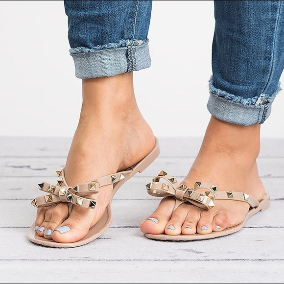 Chic Signature | Gold Studded Jelly Thong Sandal with Bow Detail | Stylish Footwear for Year-Round Elegance