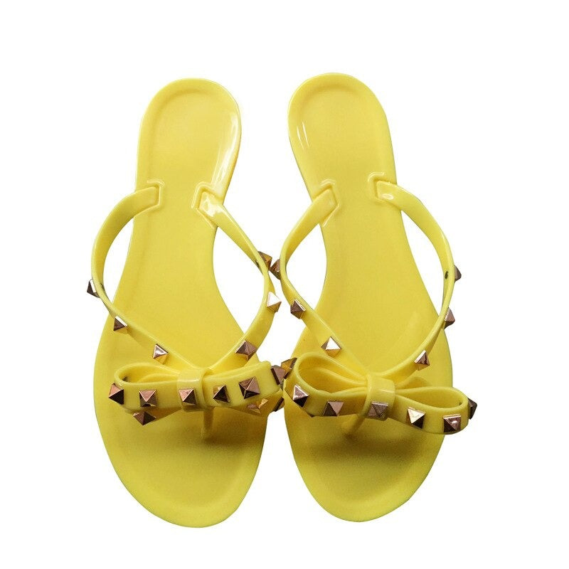 Chic Signature | Gold Studded Jelly Thong Sandal with Bow Detail | Stylish Footwear for Year-Round Elegance