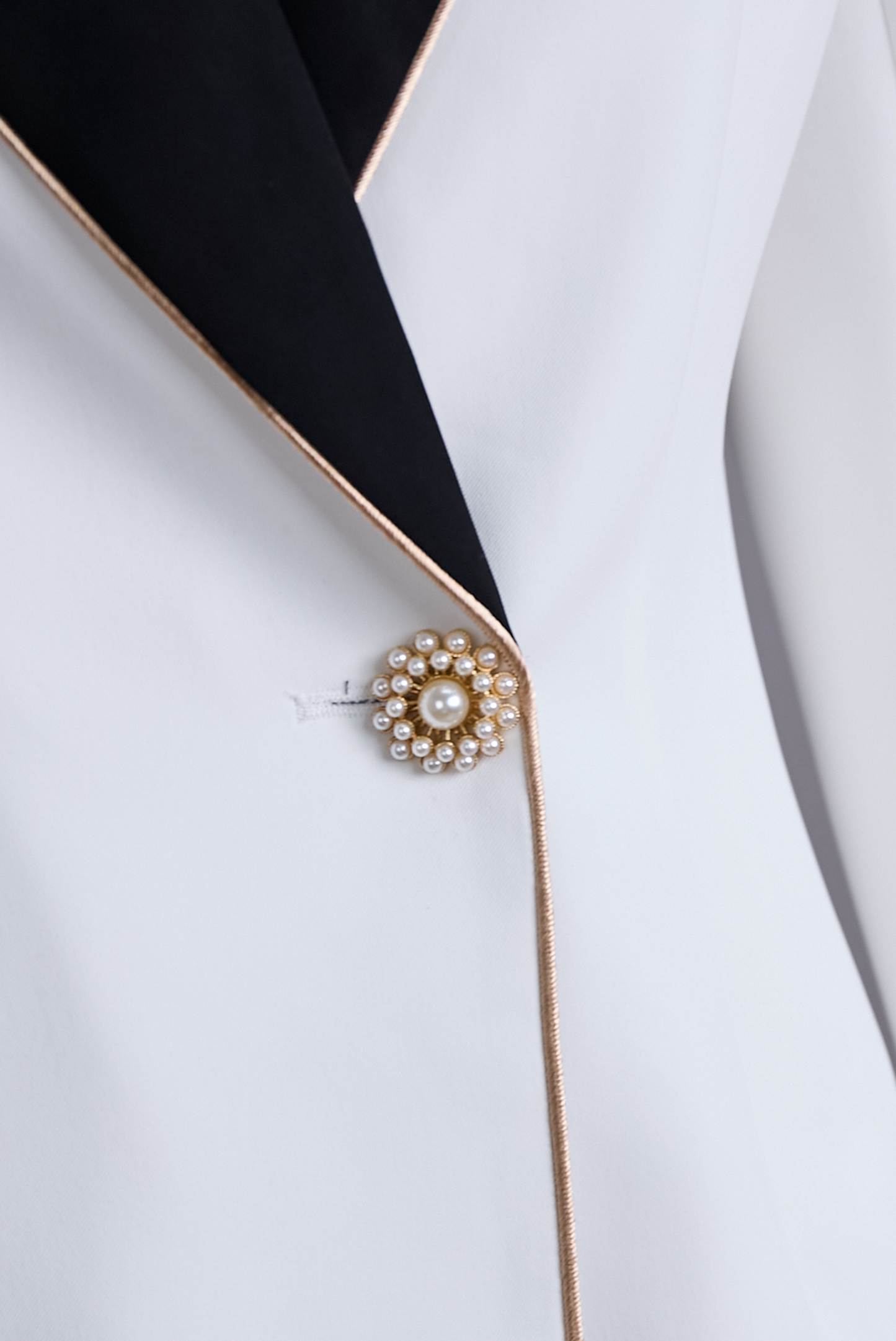 Elegant White Blazer with Asymmetrical Design & Black Lapels | Sophisticated Style for Formal Occasions